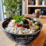 Close up of a Mediterranean protein bowl featuring grilled halloumi and lentils.