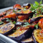 Close-up view of a bowl of pâtes aux aubergines with vibrant vegetables.
