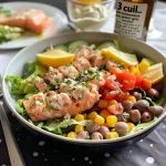 Close-up view of a vibrant salad with tuna, chickpeas, and fresh vegetables.